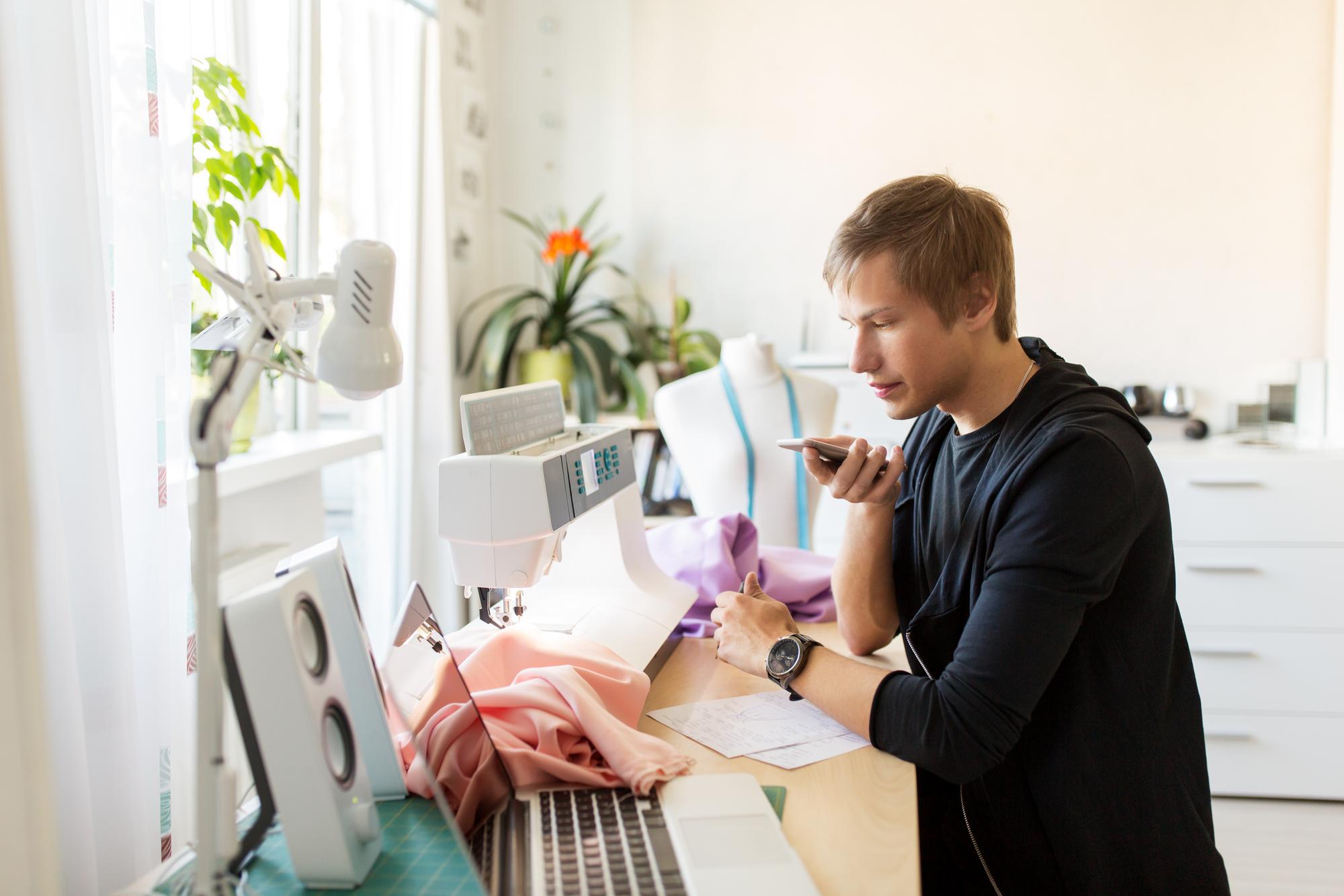 Instructor working at tidy embroidery workspace